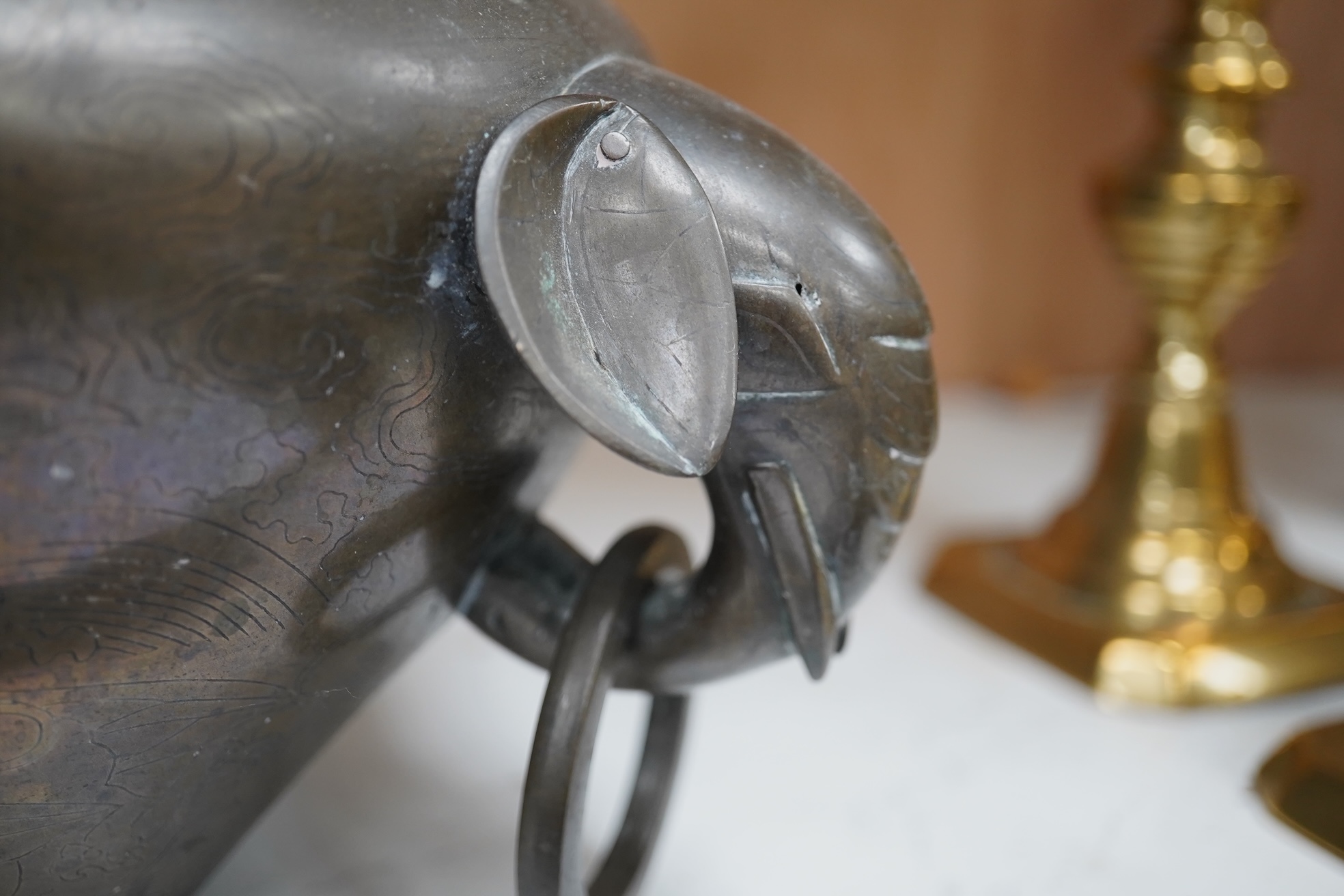 A large Chinese silver inlaid bronze elephant handled censer, signed Sishou, 19th century, 16cms high, 29cm wide. Condition - fair